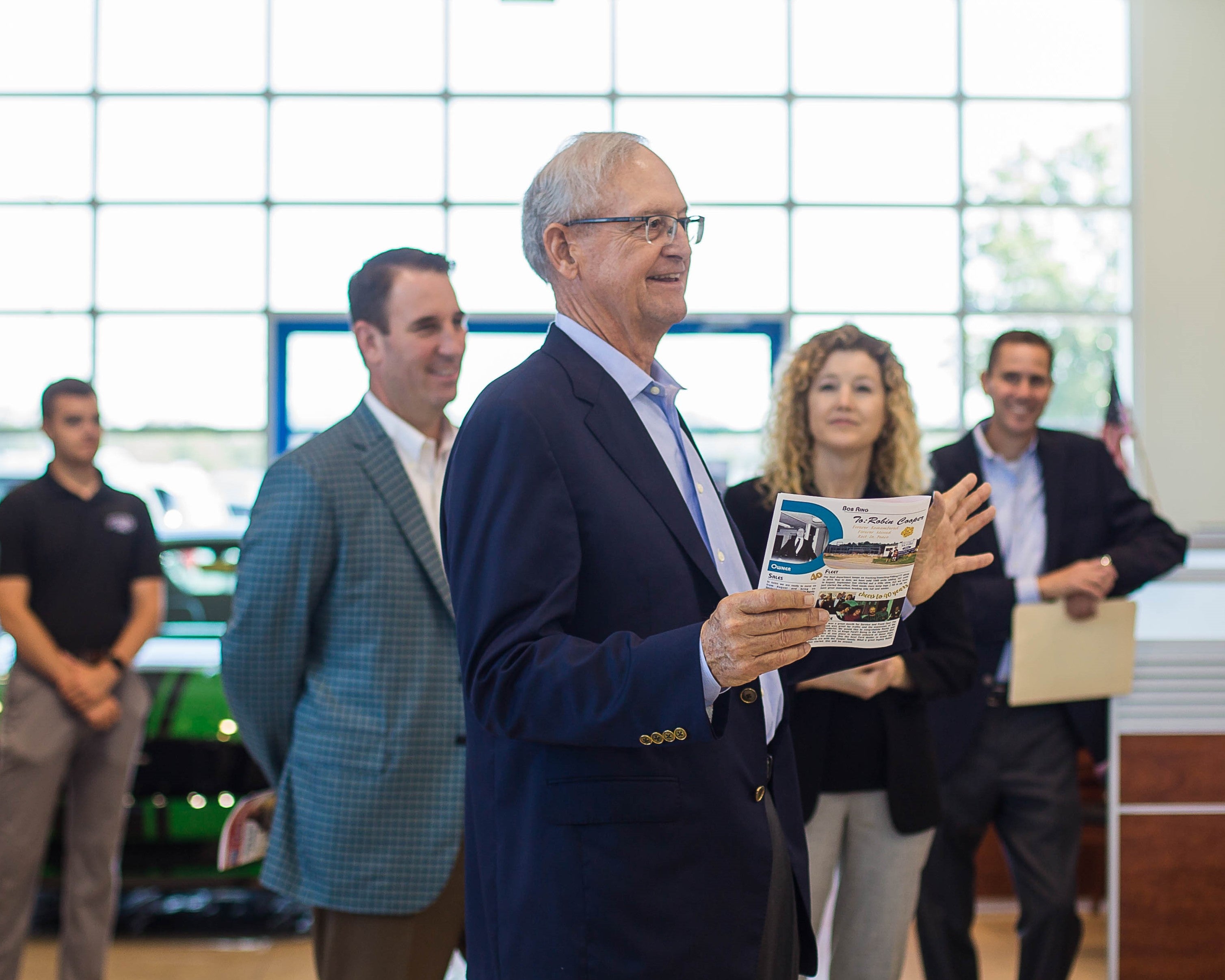 man talking at dealership