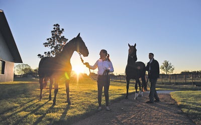 Charlie Gilchrist and wife with horses