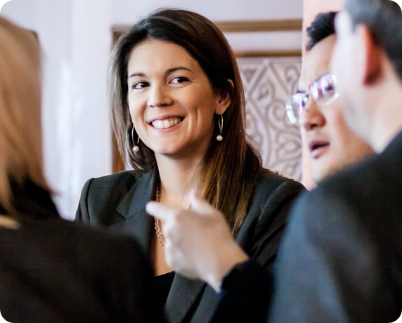 Professional Woman Smiling at a Business Meeting