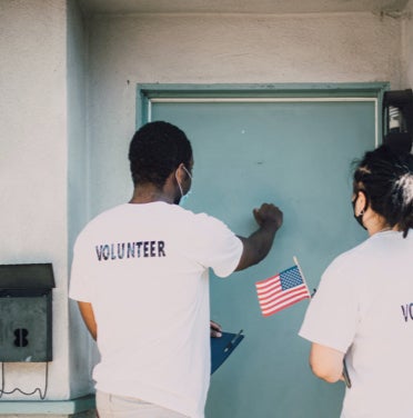 Volunteers knocking on the door