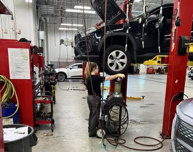 Stephanie Hanlon working on a vehicle